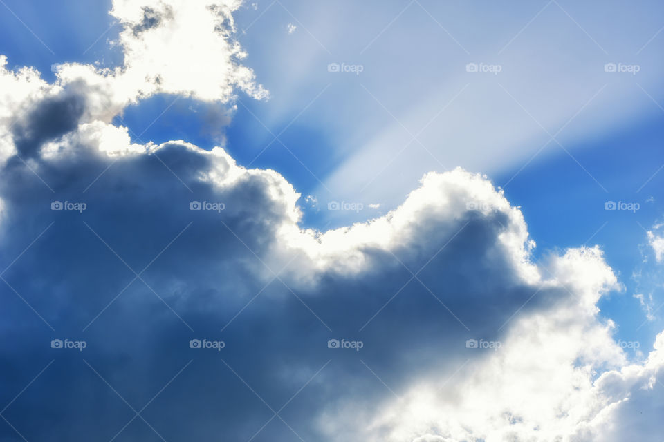 sun light over a cloudy day