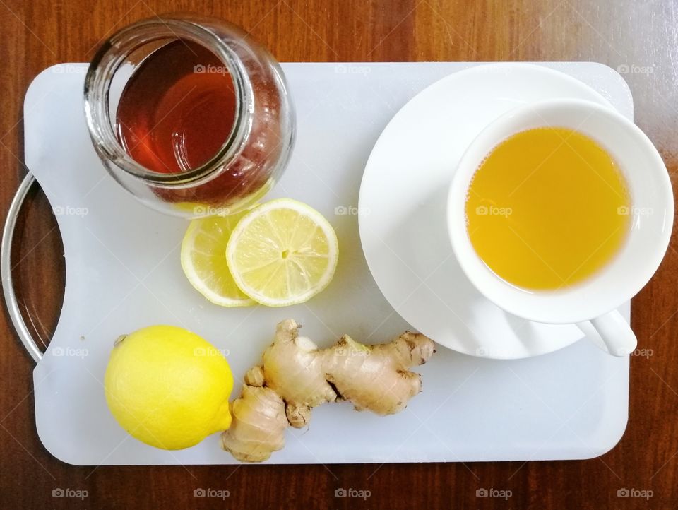A healthy early morning drink with ginger, honey and lemon.