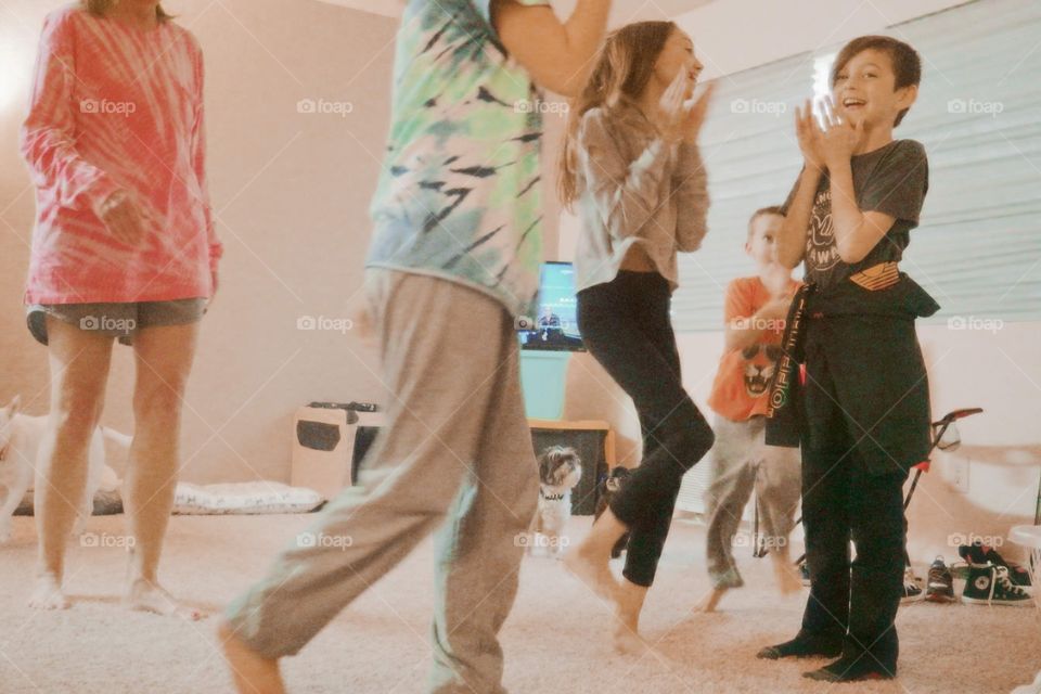 cousins playing indoors