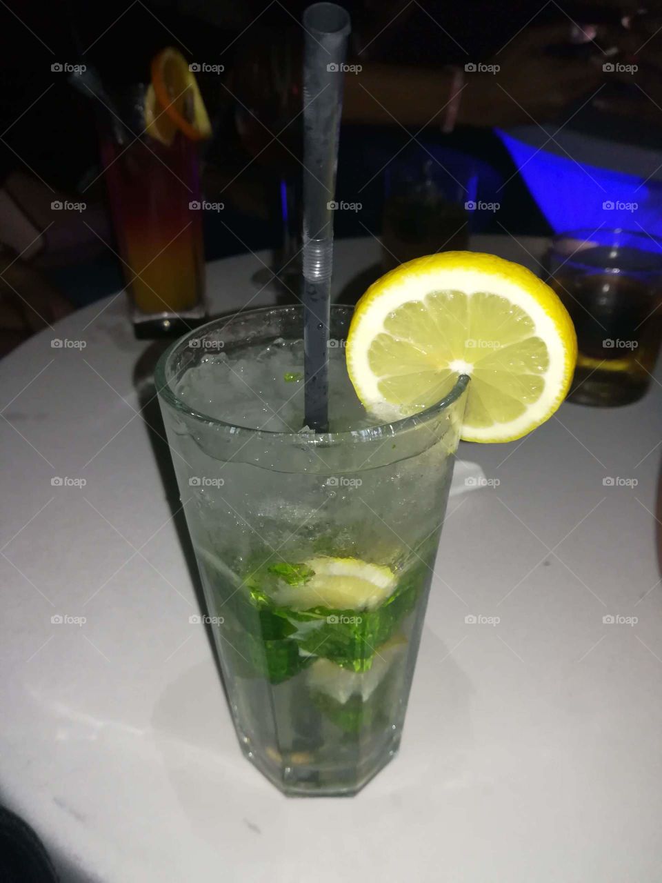 Refreshing mojito with lemon, rum and ice.