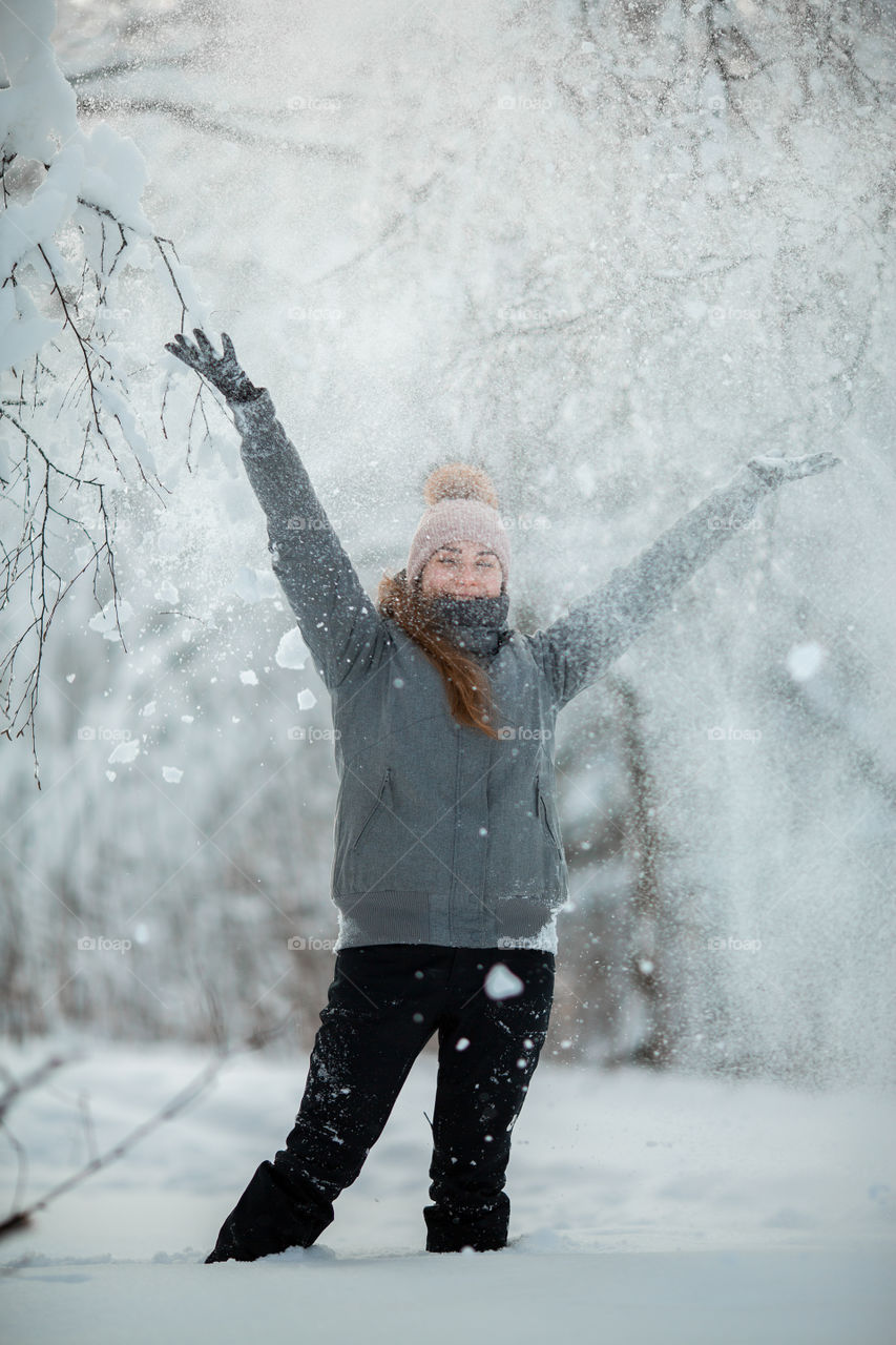 Funny girl portrait with snow