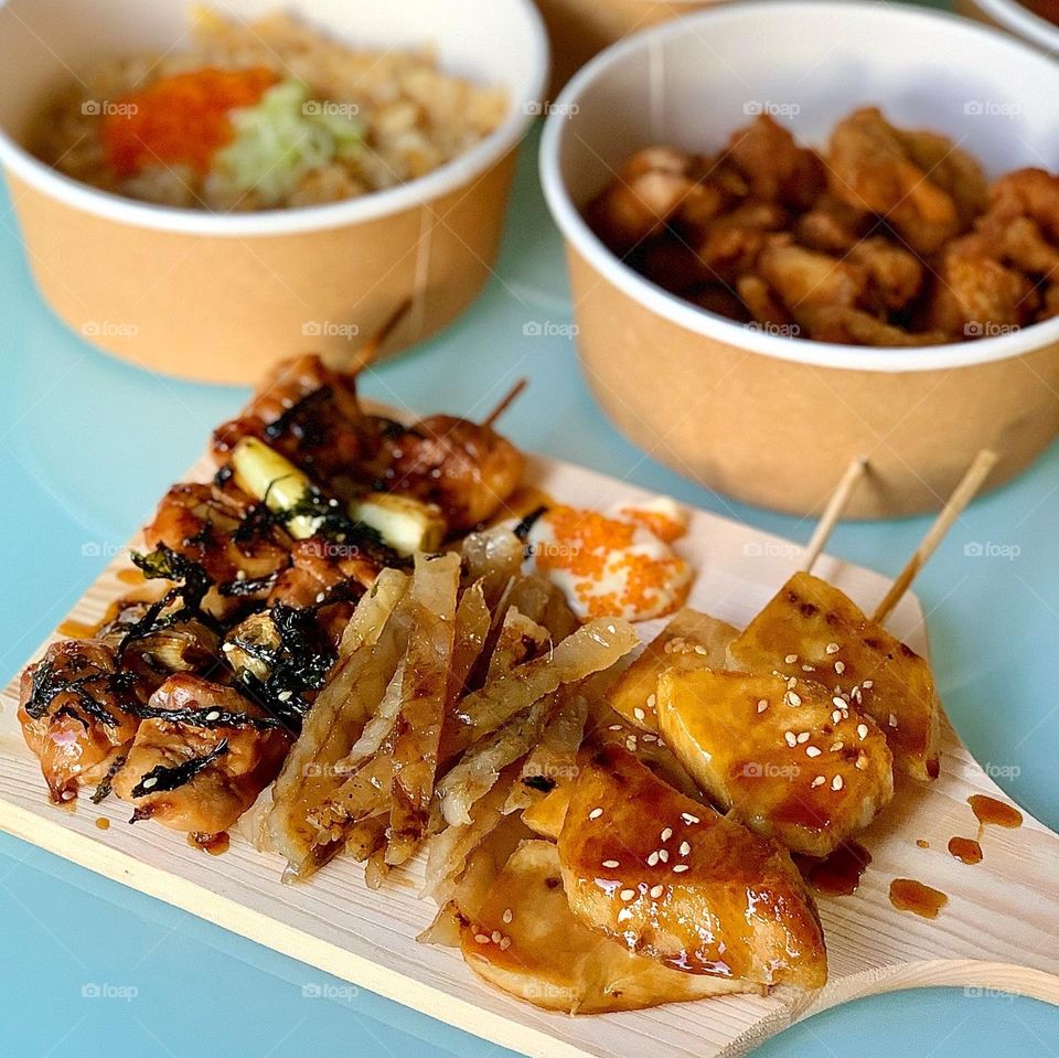 Japanese food delivery - grilled yakitori sticks and fugu mirin boshi