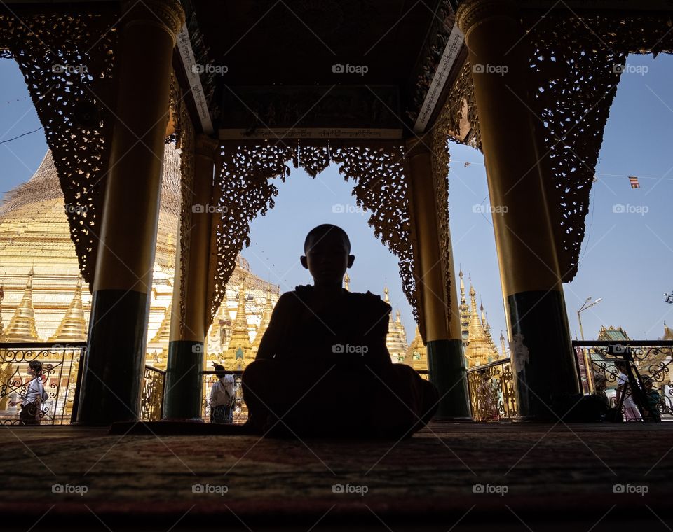 Rangoon/Myanmar-April 13 2019:A little monk Is siting to make Meditation at Shwedagon Pagoda