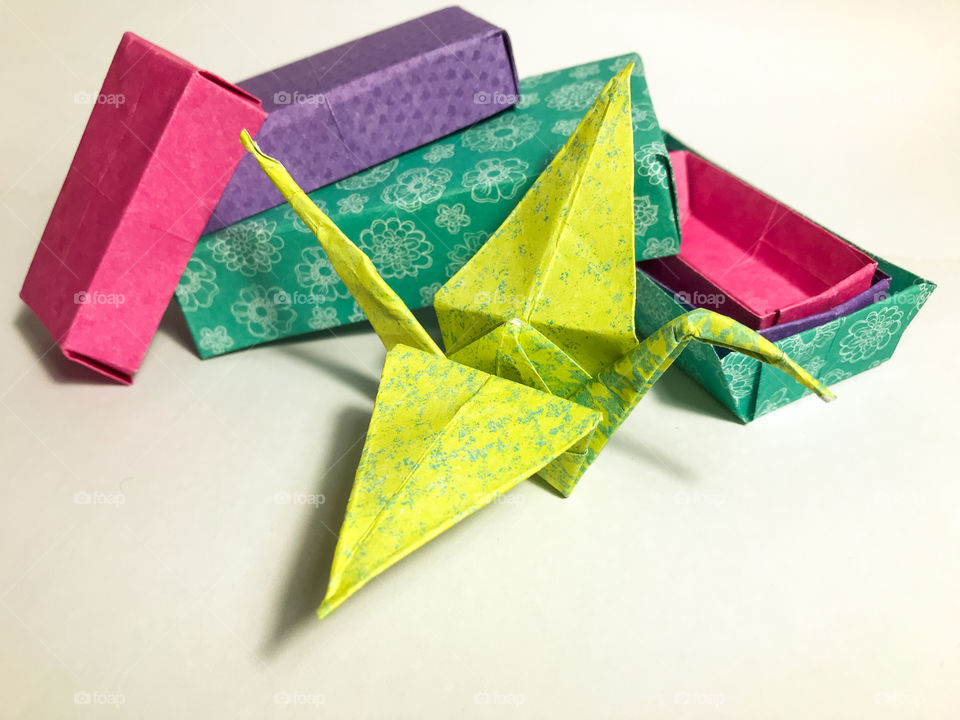 Teaching myself a new hobby with the help of the internet. Origami! Here are some little boxes & my very first crane! All done in colourful, patterned paper in shades of yellow, pink, turquoise & purple. 