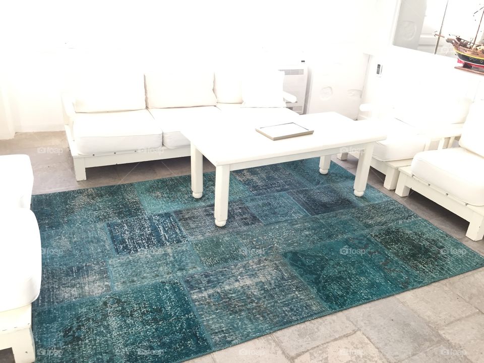 Blue rug with simple white furniture, Mediterranean style interior design