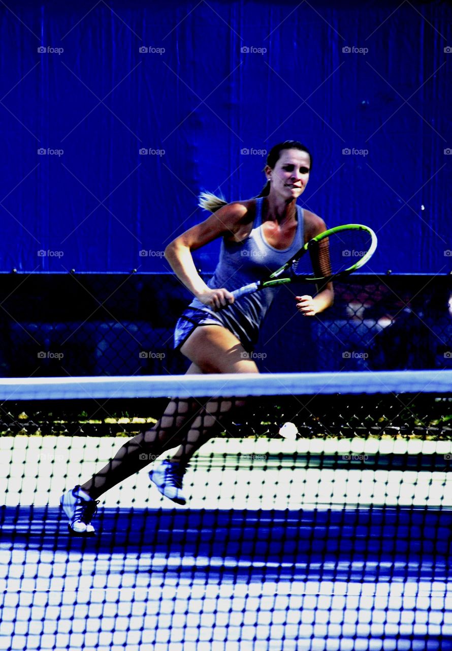 Woman in sportswear playing tennis