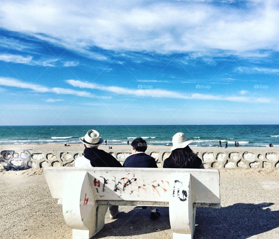 sitting by the beach 