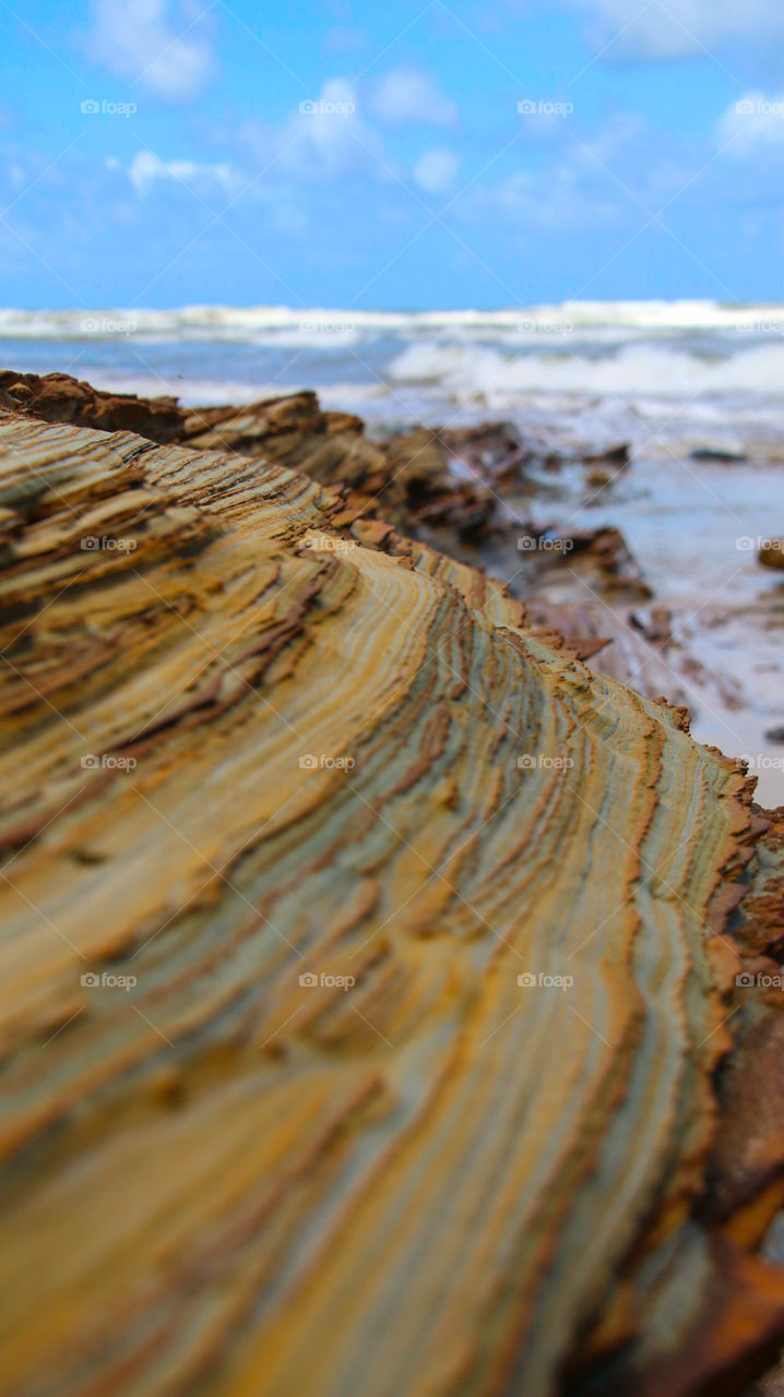 Orange rocks overlooking the blue ocean