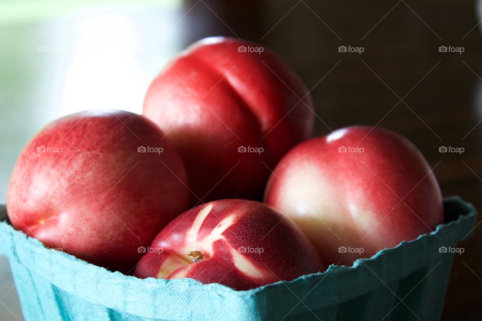 Nectarines in a carboard carton