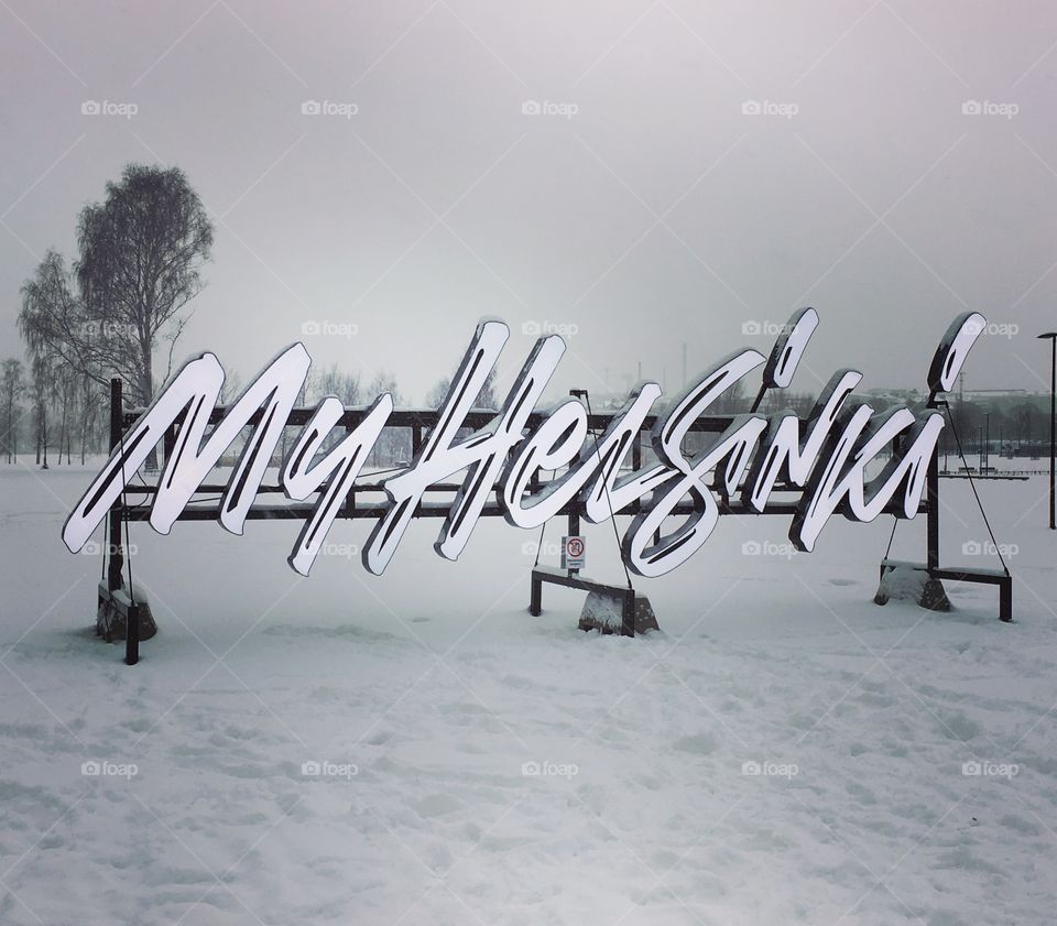 My Helsinki sign, snow backdrop 