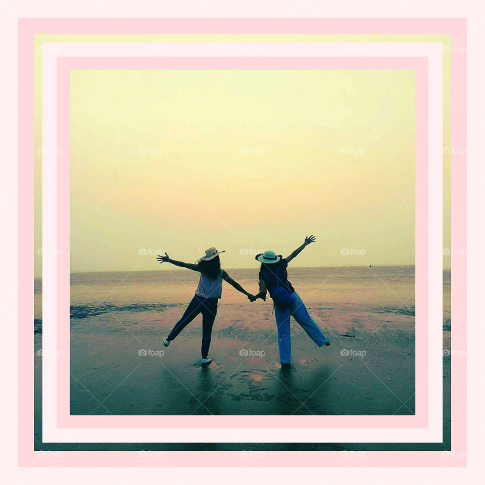 Myself and my friend Suprabha on Boisar black sand beach in outskirts of Mumbai, living the dusk moment in happiness and harmony. Red ball darling Sun is saying goodbye and water was receded way far beyond vision,1day best spent out of Doctor's life.