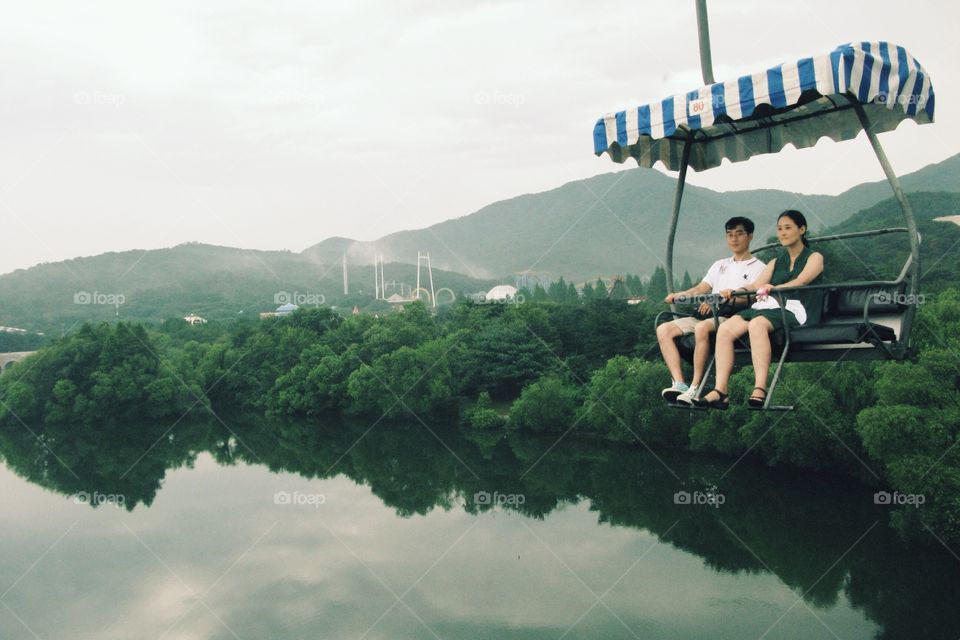 Couple on sky cable . Couple on the sky cable in the beautiful garden view