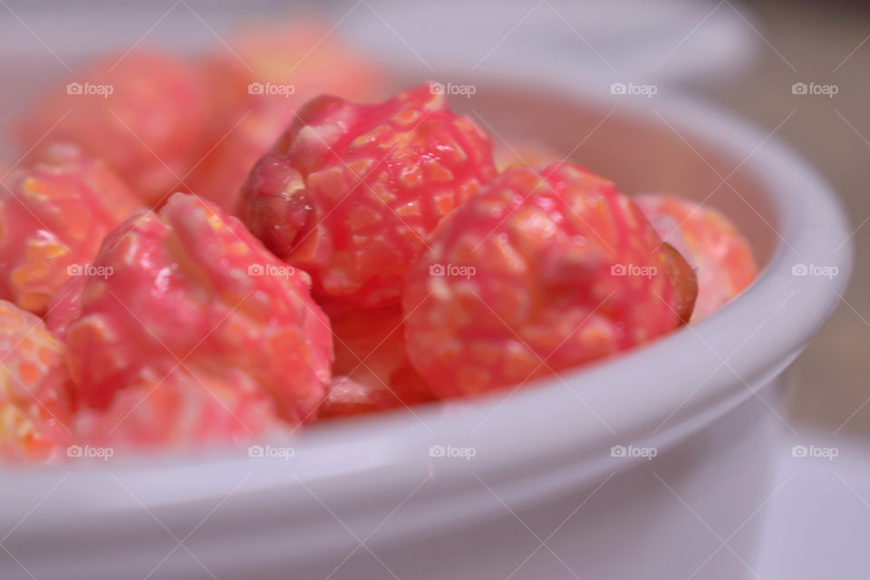 Pink popcorn on bowl