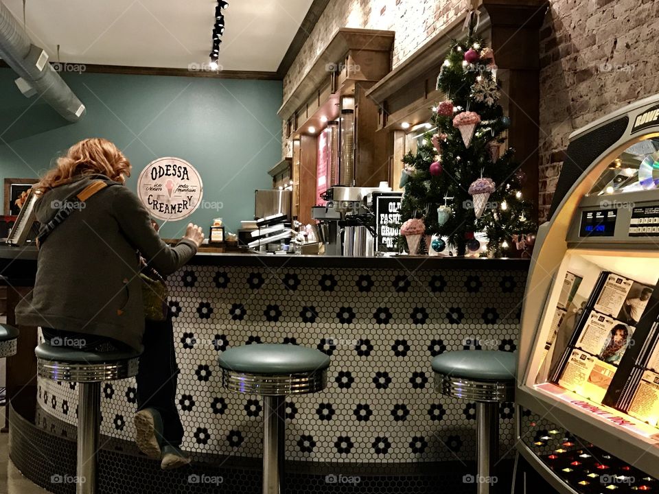 Young Woman in an Old Fashioned Ice Cream Shop