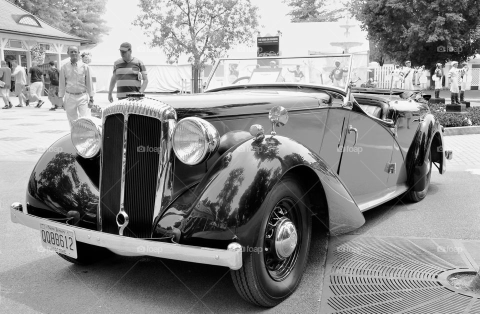 Vintage Classic Cars . Vintage classic cars parked in front of the oldest track in America. This classic car is a vintage import. 
Fleetphoto