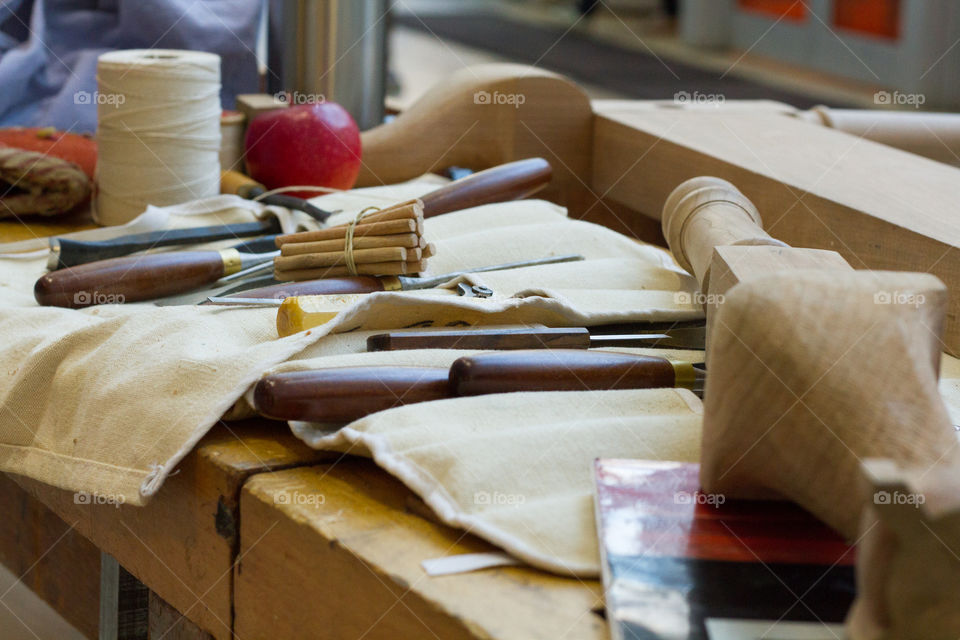 Woodworking tools scattered on a work bench