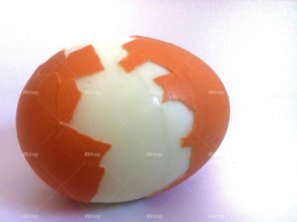 Half peeled egg