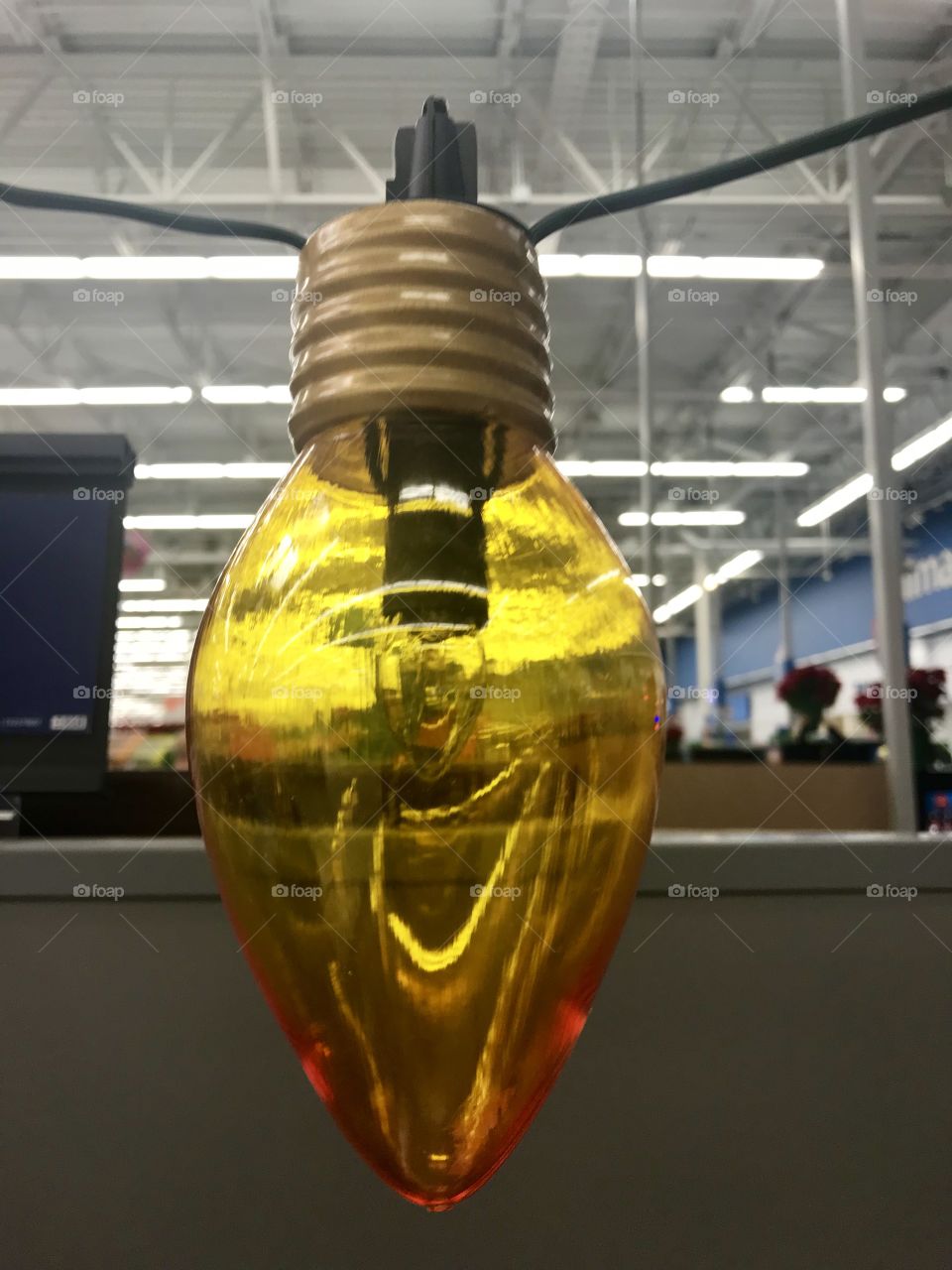 And beautiful yellow Christmas light display on a string, at the store in America, USA. 