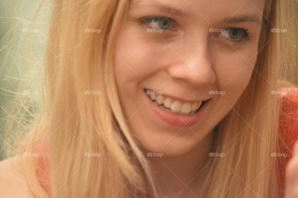 Close-up of blonde woman smiling
