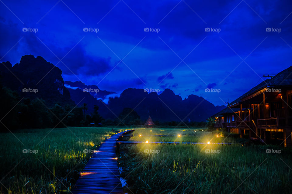 Landmark of Laos -  Field in the Evening at Vieng Tara Villa, Vang Vieng, Laos : July 7, 2018