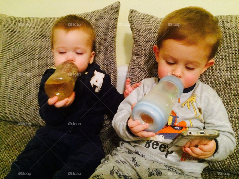 Two boy drinking water