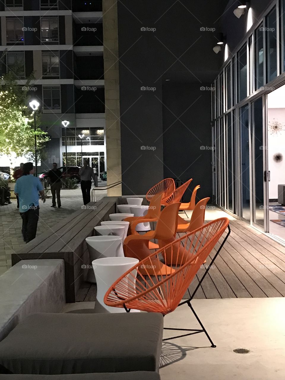 Orange seating provides an interesting pop of color!