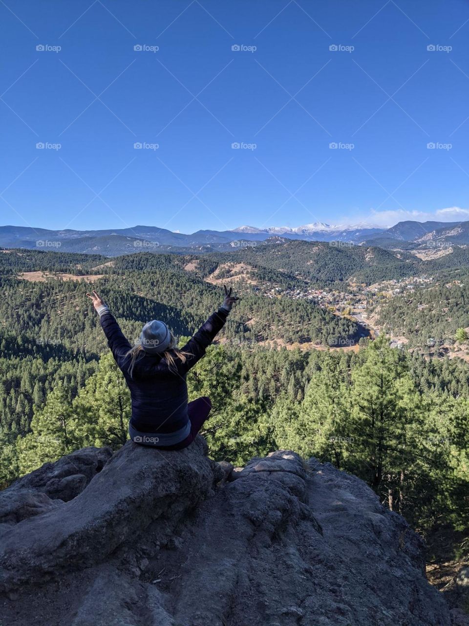 mountain hike excitement overlooking the mountain and forest views feeling accomplished and excited climbed to the top peacful