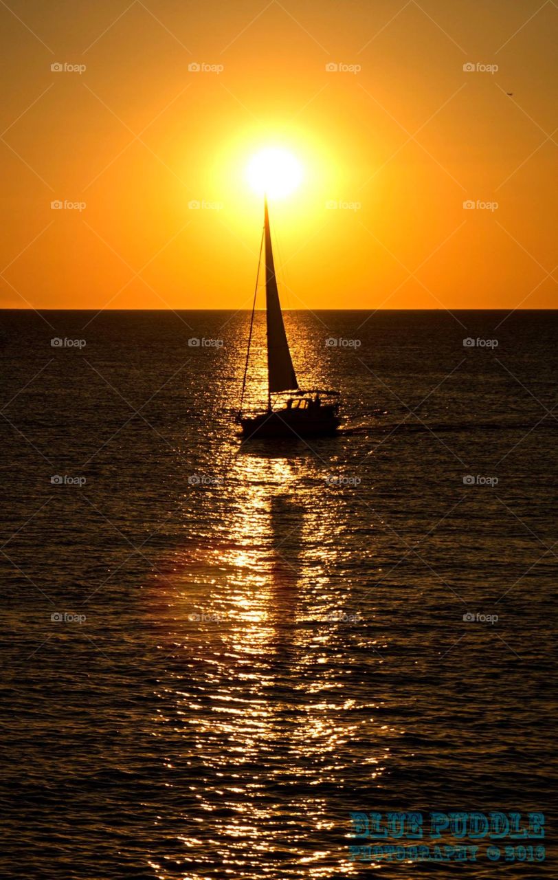 Sunset boat photography at sunset. Silhouette of a yacht on the ocean at dusk In pula Croatia 