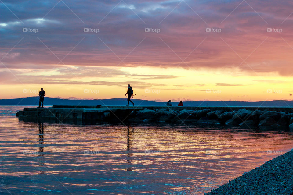 Fishermen and sunset