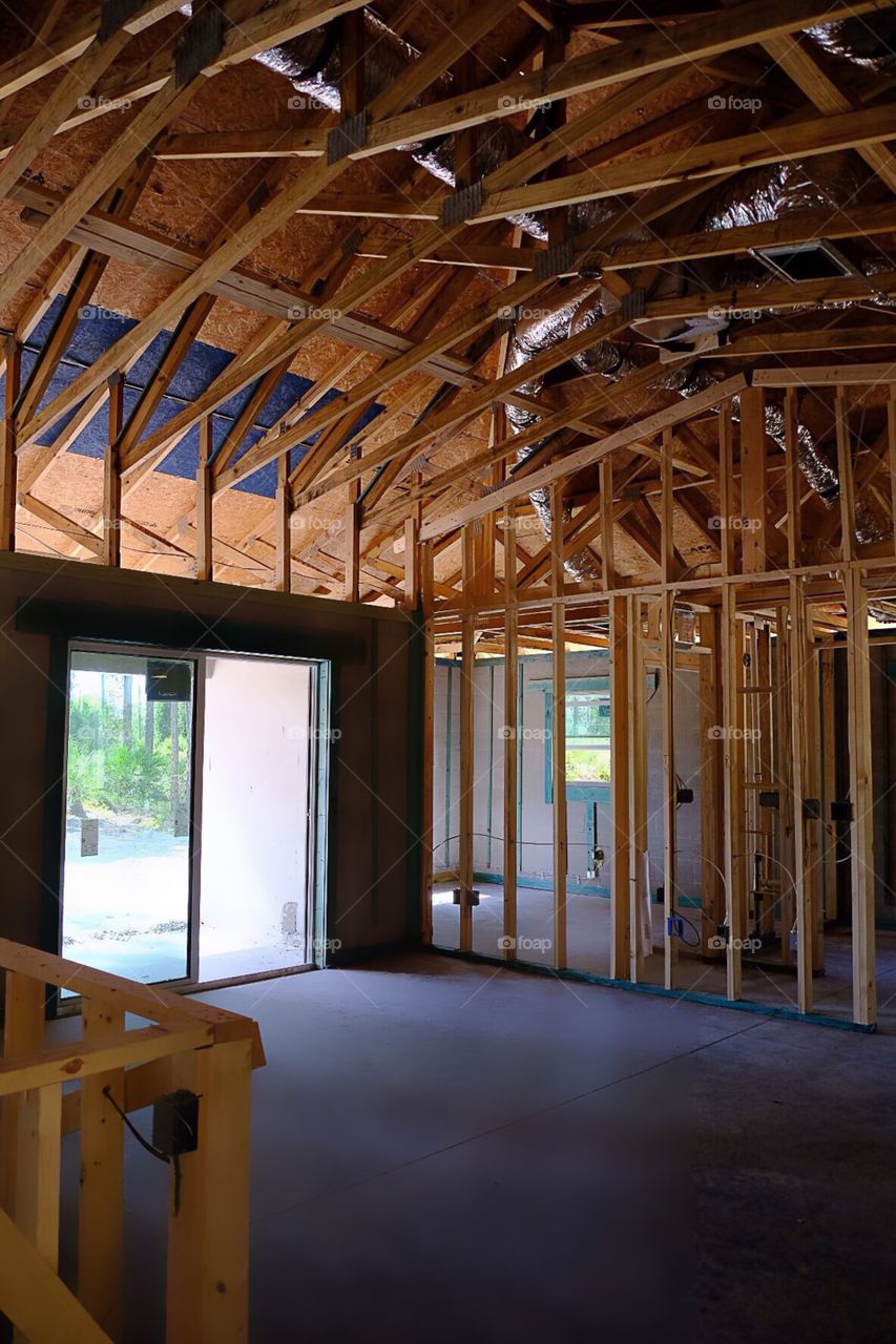 Wooden framing supporting a new house.