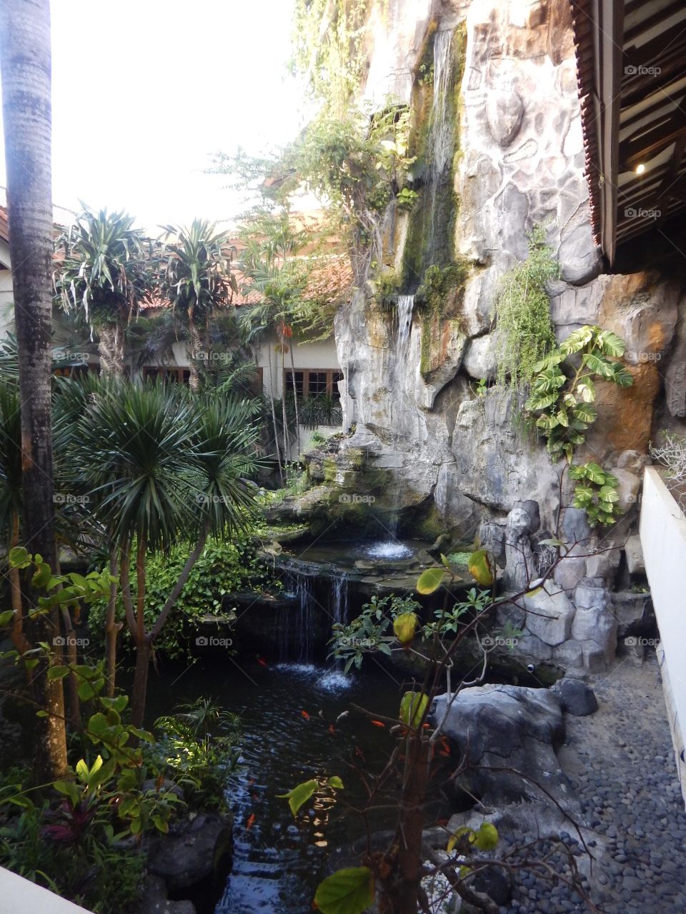 Waterfall water feature inside Balinese hotel