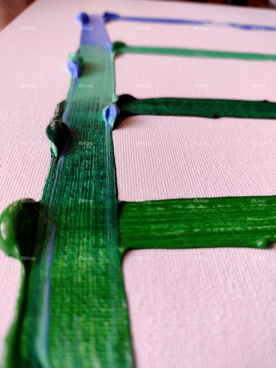 Unfiltered, beautiful, lovely close-up of green paint strokes on a canvas