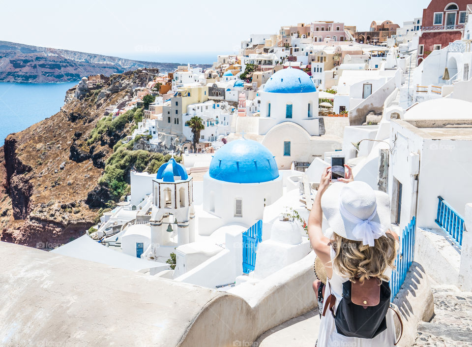 Tourist Woman Taking Photo With Smartphone In Famous Greek Island Santorini