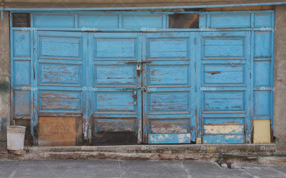 Old weathered wooden blue entrance way in San Miguel de Allende, Mexico,