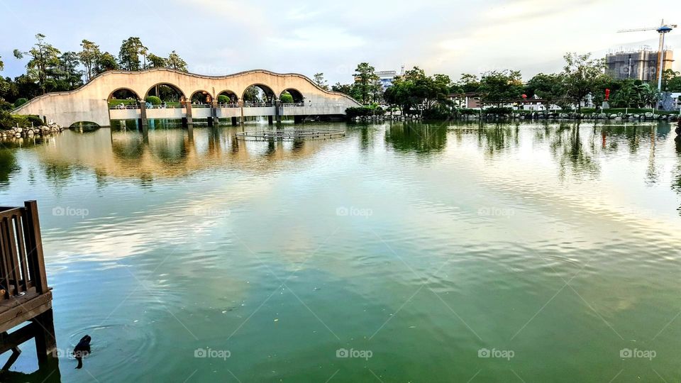 Beautiful view of the bridge and lake in Fengle Sculpture Park, Taichung, Nantun, Taiwan