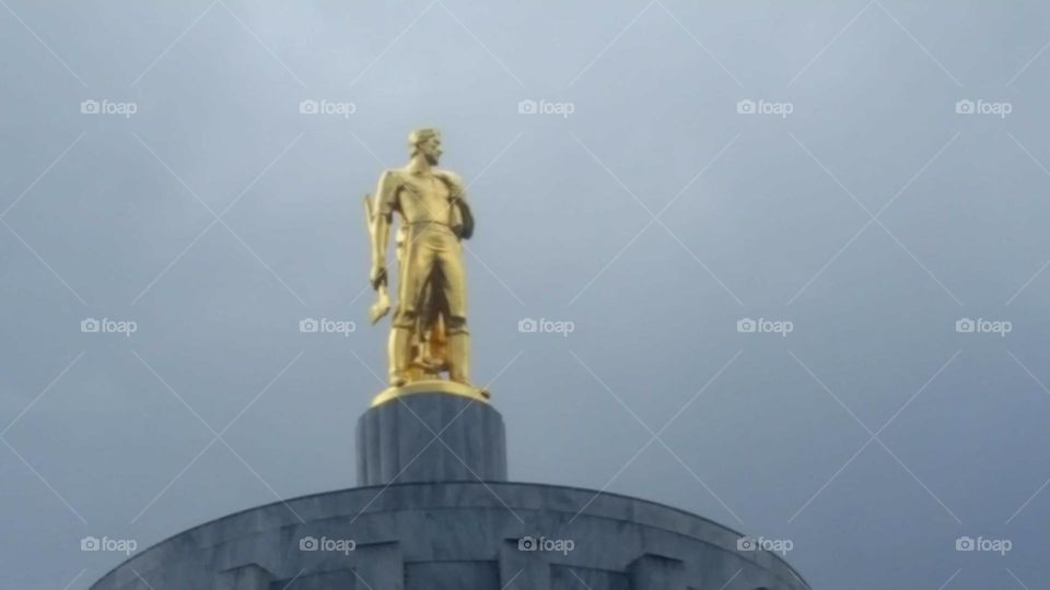 Gold man at Oregon State capitol.