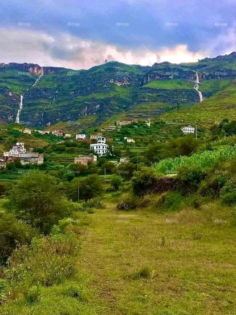 A stunning view of green mountains covered in fog in Yemen
