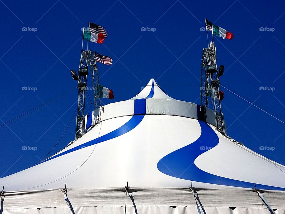 American and Italian flags fly high atop Cirque Italia, world's first water circus.
