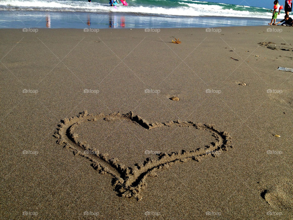 Heart drawn on sand at beach, Hollywood Beach, Florida