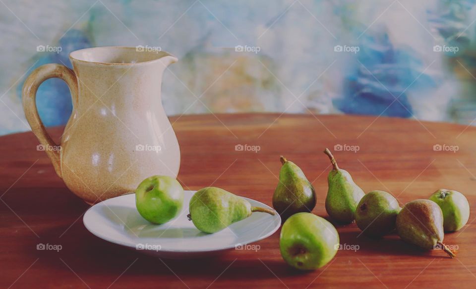 Still life with apples, pears and water jug