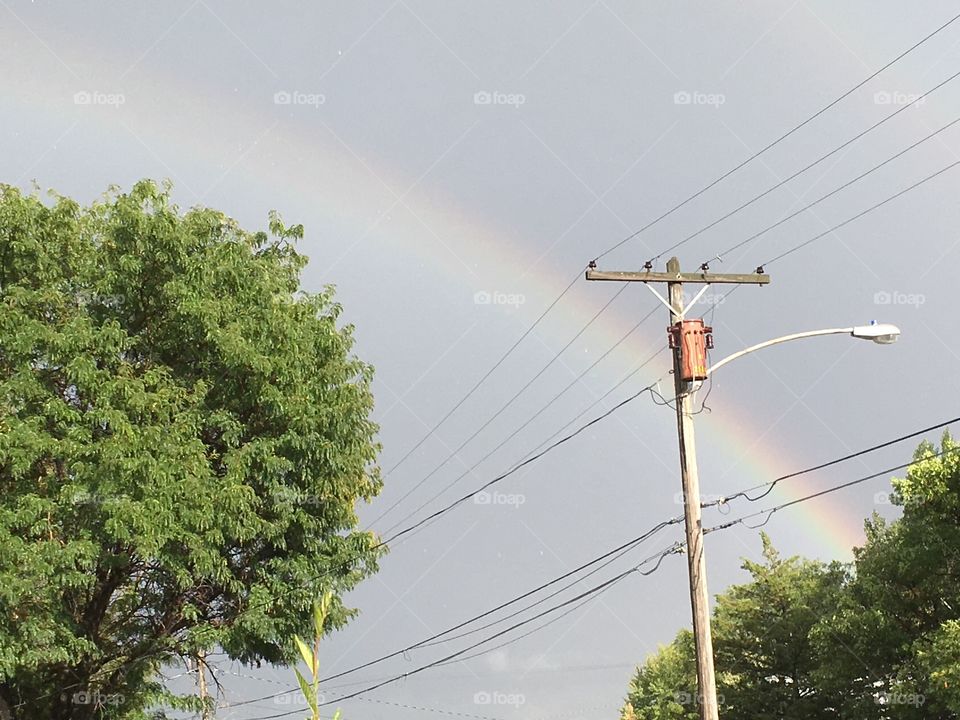 Rainbow and power lines 