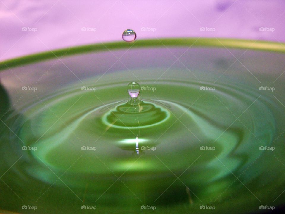 Drop in the Bucket. Water droplets action shot