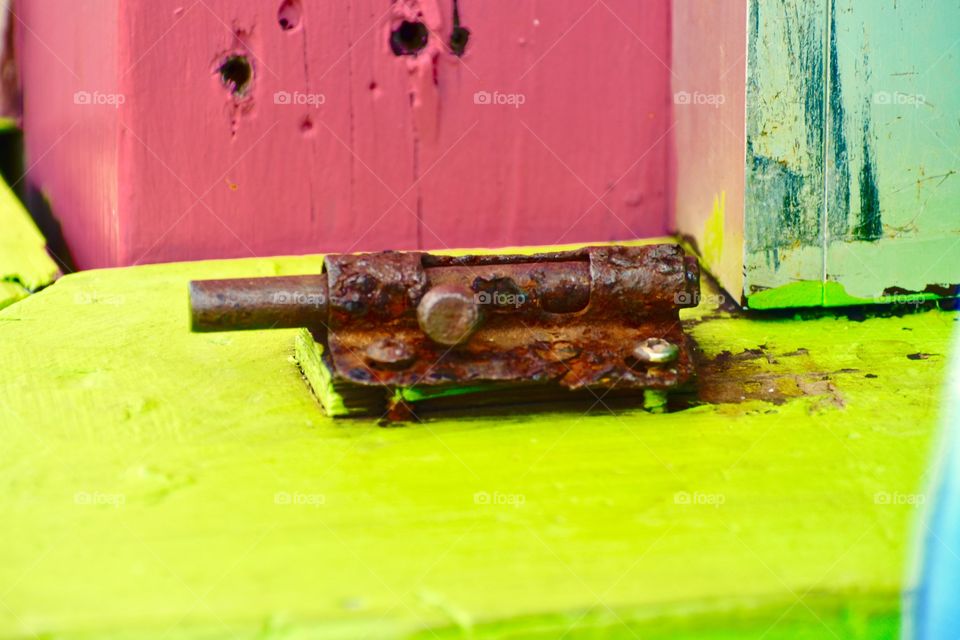 Rusty lock on pier