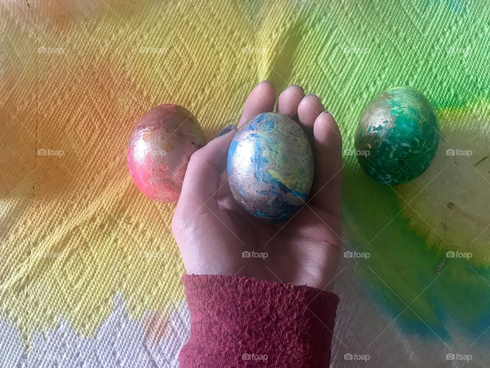 Holding an Easter egg 