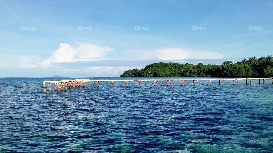 Pier in a coastal village. Natural landscape photos for various websites, backgrounds, desktops and more.