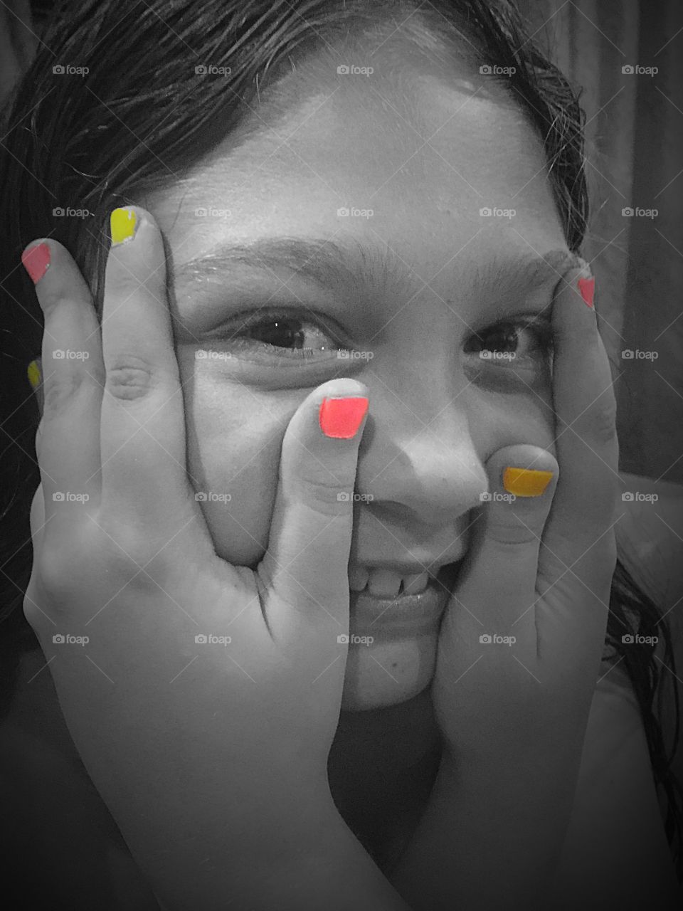 Girl showing colorful nail polish