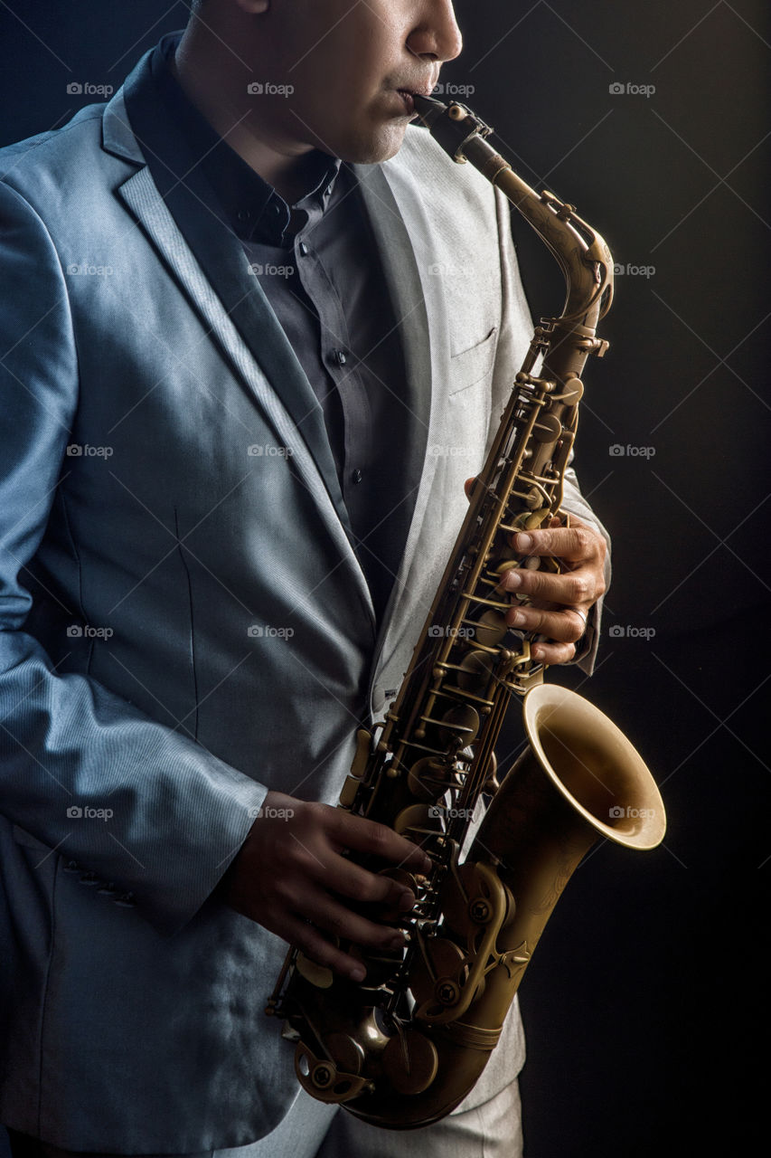 playing saxophone