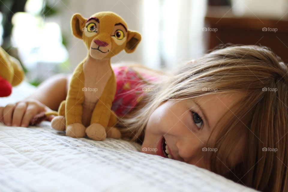 A soft stuffie lion can be a girl's favorite toy, bringing happiness to her eyes.