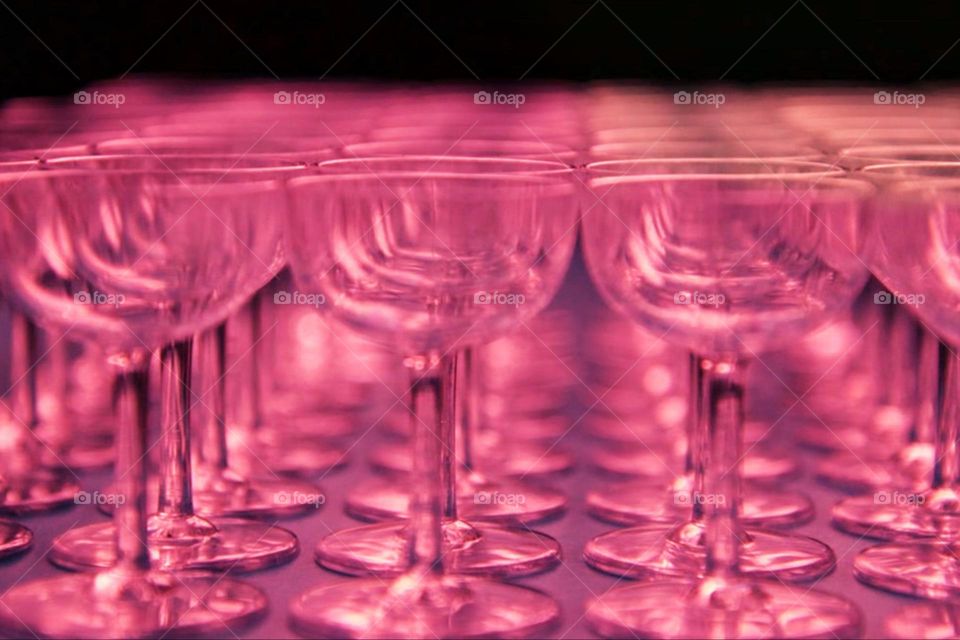 Small pink champagne glasses in a row