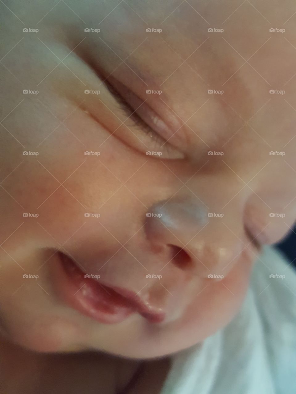 Extreme close-up of sleeping baby's face